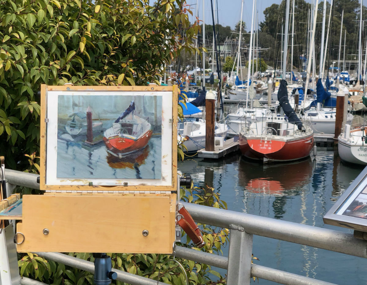 Paintbox with orange sailboat